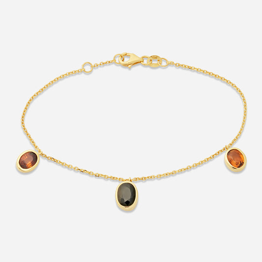 Handgjort armband smycken i 18 karat guld med tre turmaliner.