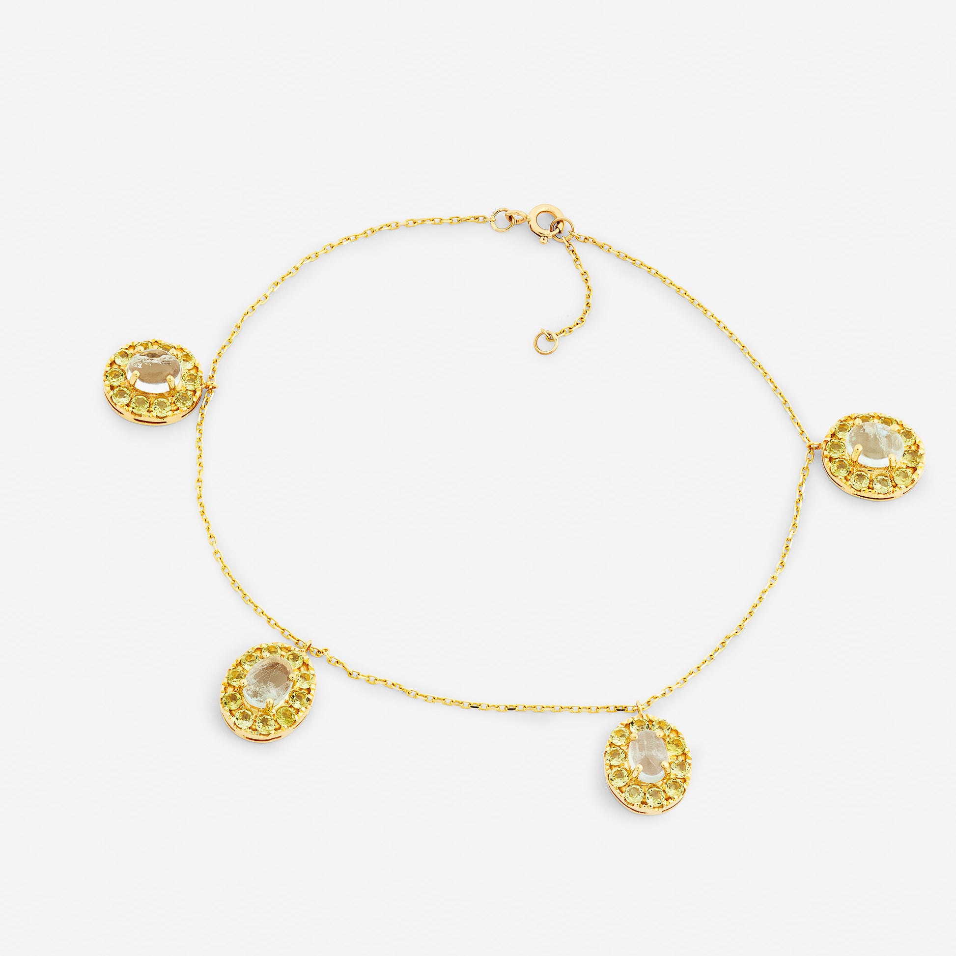 Handgjord fotlänk smycken i 18 karat guld med akvamarin och peridot.
